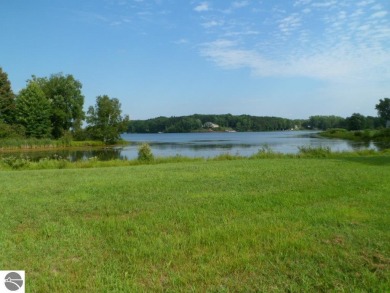 Large scenic waterfront lot at Whispering Pines Cove on the on The Pines Golf Course at Lake Isabella in Michigan - for sale on GolfHomes.com, golf home, golf lot