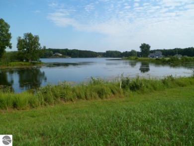 Large scenic waterfront lot at Whispering Pines Cove on the on The Pines Golf Course at Lake Isabella in Michigan - for sale on GolfHomes.com, golf home, golf lot