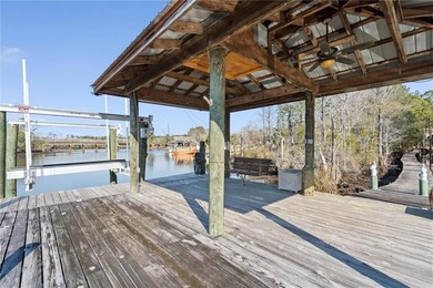 This exceptional waterfront home features 4 bedrooms and 4 on Cypress Country Club and Golf Club  in Alabama - for sale on GolfHomes.com, golf home, golf lot