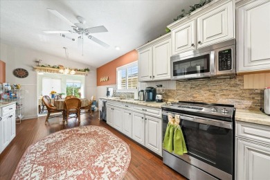Morning coffee or evening cocktails on the enclosed lanai on Spanish Lakes Fairways in Florida - for sale on GolfHomes.com, golf home, golf lot