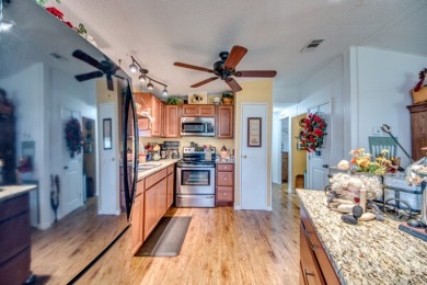 This great two-bed, two-bath home is located on the course at on Pine Lakes Country Club in Florida - for sale on GolfHomes.com, golf home, golf lot