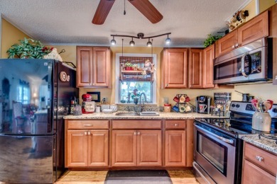 This great two-bed, two-bath home is located on the course at on Pine Lakes Country Club in Florida - for sale on GolfHomes.com, golf home, golf lot