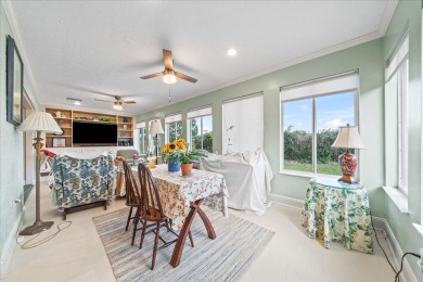 Morning coffee or evening cocktails on the enclosed lanai on Spanish Lakes Fairways in Florida - for sale on GolfHomes.com, golf home, golf lot