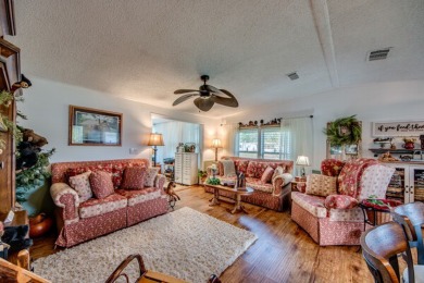 This great two-bed, two-bath home is located on the course at on Pine Lakes Country Club in Florida - for sale on GolfHomes.com, golf home, golf lot
