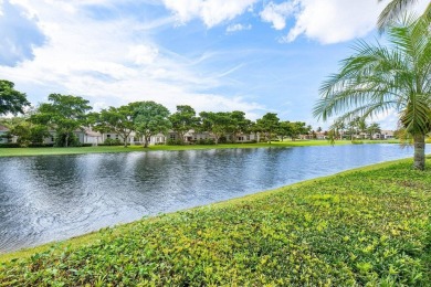 Stunning, two-story 4 BD 4 BA plus office home with lake views on Woodfield Country Club in Florida - for sale on GolfHomes.com, golf home, golf lot