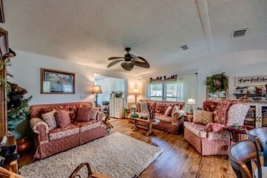 This great two-bed, two-bath home is located on the course at on Pine Lakes Country Club in Florida - for sale on GolfHomes.com, golf home, golf lot