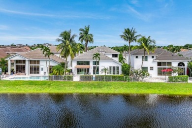 Stunning, two-story 4 BD 4 BA plus office home with lake views on Woodfield Country Club in Florida - for sale on GolfHomes.com, golf home, golf lot