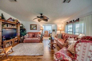 This great two-bed, two-bath home is located on the course at on Pine Lakes Country Club in Florida - for sale on GolfHomes.com, golf home, golf lot