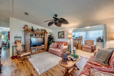 This great two-bed, two-bath home is located on the course at on Pine Lakes Country Club in Florida - for sale on GolfHomes.com, golf home, golf lot