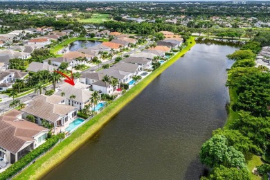 Stunning, two-story 4 BD 4 BA plus office home with lake views on Woodfield Country Club in Florida - for sale on GolfHomes.com, golf home, golf lot