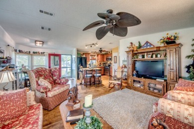 This great two-bed, two-bath home is located on the course at on Pine Lakes Country Club in Florida - for sale on GolfHomes.com, golf home, golf lot