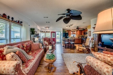This great two-bed, two-bath home is located on the course at on Pine Lakes Country Club in Florida - for sale on GolfHomes.com, golf home, golf lot