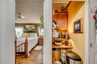 This great two-bed, two-bath home is located on the course at on Pine Lakes Country Club in Florida - for sale on GolfHomes.com, golf home, golf lot
