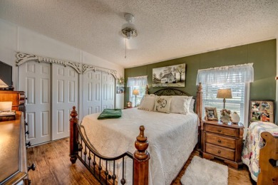 This great two-bed, two-bath home is located on the course at on Pine Lakes Country Club in Florida - for sale on GolfHomes.com, golf home, golf lot
