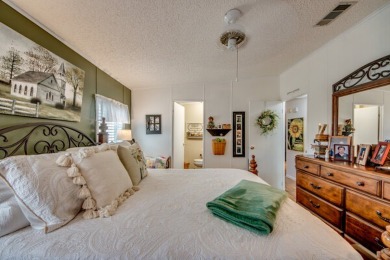 This great two-bed, two-bath home is located on the course at on Pine Lakes Country Club in Florida - for sale on GolfHomes.com, golf home, golf lot