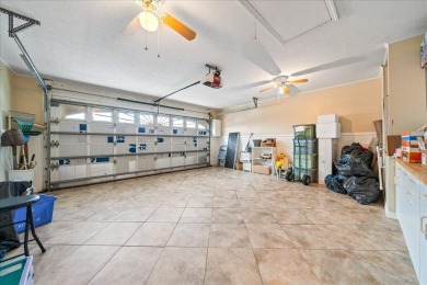 Morning coffee or evening cocktails on the enclosed lanai on Spanish Lakes Fairways in Florida - for sale on GolfHomes.com, golf home, golf lot