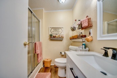 This great two-bed, two-bath home is located on the course at on Pine Lakes Country Club in Florida - for sale on GolfHomes.com, golf home, golf lot