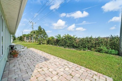 Morning coffee or evening cocktails on the enclosed lanai on Spanish Lakes Fairways in Florida - for sale on GolfHomes.com, golf home, golf lot
