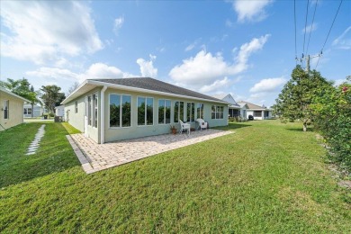 Morning coffee or evening cocktails on the enclosed lanai on Spanish Lakes Fairways in Florida - for sale on GolfHomes.com, golf home, golf lot