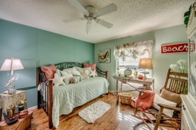 This great two-bed, two-bath home is located on the course at on Pine Lakes Country Club in Florida - for sale on GolfHomes.com, golf home, golf lot