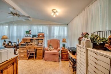 This great two-bed, two-bath home is located on the course at on Pine Lakes Country Club in Florida - for sale on GolfHomes.com, golf home, golf lot