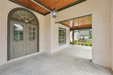 Set on one of the rarest golf-course placements in Governors on The Governors Towne Club in Georgia - for sale on GolfHomes.com, golf home, golf lot