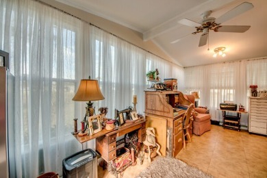 This great two-bed, two-bath home is located on the course at on Pine Lakes Country Club in Florida - for sale on GolfHomes.com, golf home, golf lot