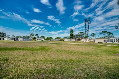 This great two-bed, two-bath home is located on the course at on Pine Lakes Country Club in Florida - for sale on GolfHomes.com, golf home, golf lot