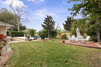 This home is located on the 5th hole of Pine Lakes Golf Course on The Grand Club - Pine Lakes Course in Florida - for sale on GolfHomes.com, golf home, golf lot