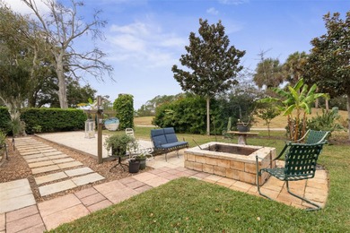 This home is located on the 5th hole of Pine Lakes Golf Course on The Grand Club - Pine Lakes Course in Florida - for sale on GolfHomes.com, golf home, golf lot