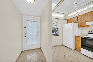 Explore this delightful first-floor unit, boasting two bedrooms on Sunrise Lakes Phase IV Golf Course in Florida - for sale on GolfHomes.com, golf home, golf lot