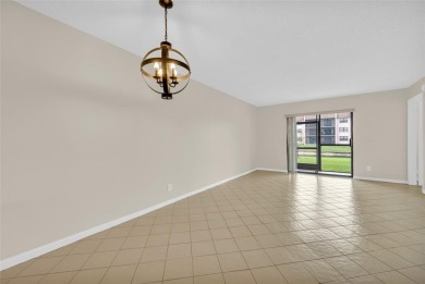 Explore this delightful first-floor unit, boasting two bedrooms on Sunrise Lakes Phase IV Golf Course in Florida - for sale on GolfHomes.com, golf home, golf lot