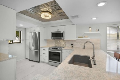 PANORAMIC GOLF COURSE AND LAKE VIEWS from every space in this on Ocean Club At the Hutchinson Island Beach Resort in Florida - for sale on GolfHomes.com, golf home, golf lot