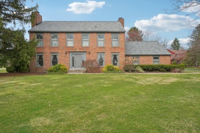Timeless Richard Adams Russell design in prestigious Travis on Travis Pointe Country Club in Michigan - for sale on GolfHomes.com, golf home, golf lot