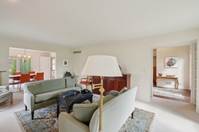Timeless Richard Adams Russell design in prestigious Travis on Travis Pointe Country Club in Michigan - for sale on GolfHomes.com, golf home, golf lot