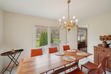 Timeless Richard Adams Russell design in prestigious Travis on Travis Pointe Country Club in Michigan - for sale on GolfHomes.com, golf home, golf lot
