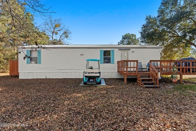 Welcome to the ultimate turnkey escape! Just a few miles from on Brick Landing Plantation Yacht and Golf Club in North Carolina - for sale on GolfHomes.com, golf home, golf lot