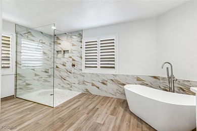 This beautifully reimagined 3-bedroom home with a private den on The Forest Country Club in Florida - for sale on GolfHomes.com, golf home, golf lot