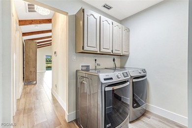 This beautifully reimagined 3-bedroom home with a private den on The Forest Country Club in Florida - for sale on GolfHomes.com, golf home, golf lot