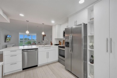 Bright and upgraded 2-bedroom 2-bath condo in a 55+ community on Oriole Golf and Tennis Club in Florida - for sale on GolfHomes.com, golf home, golf lot