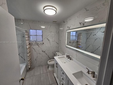 Beautifully renovated one-story home in the sought-after Doral on Jim McLean Signature Course in Florida - for sale on GolfHomes.com, golf home, golf lot