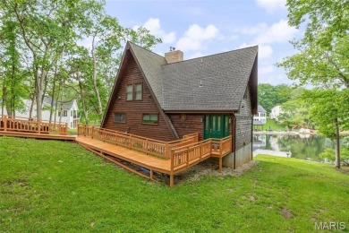 Welcome to your dream Lodge-like home nestled on a sprawling on Raintree Country Club in Missouri - for sale on GolfHomes.com, golf home, golf lot
