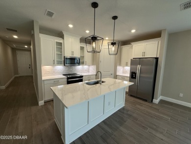 Introducing a brand-new, energy-efficient home available for on LPGA International Golf Course in Florida - for sale on GolfHomes.com, golf home, golf lot
