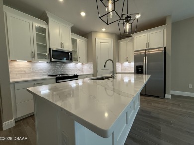Introducing a brand-new, energy-efficient home available for on LPGA International Golf Course in Florida - for sale on GolfHomes.com, golf home, golf lot
