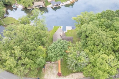 Welcome to your dream Lodge-like home nestled on a sprawling on Raintree Country Club in Missouri - for sale on GolfHomes.com, golf home, golf lot