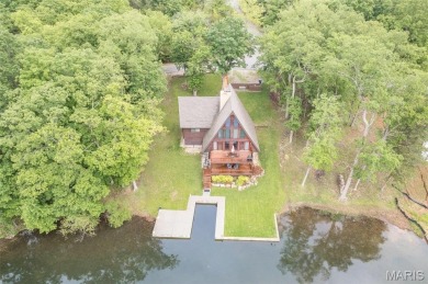 Welcome to your dream Lodge-like home nestled on a sprawling on Raintree Country Club in Missouri - for sale on GolfHomes.com, golf home, golf lot