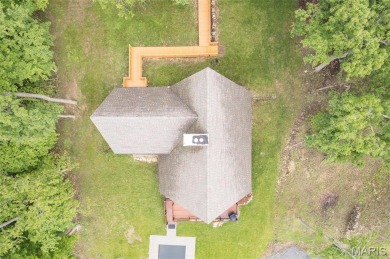 Welcome to your dream Lodge-like home nestled on a sprawling on Raintree Country Club in Missouri - for sale on GolfHomes.com, golf home, golf lot