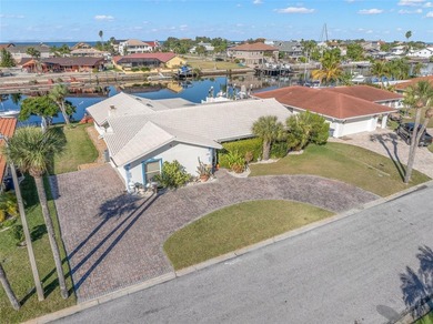 Experience the ultimate Gulf Harbors waterfront lifestyle in on Gulf Harbors Golf Course in Florida - for sale on GolfHomes.com, golf home, golf lot