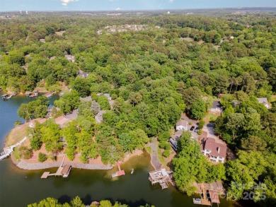 Why just live near the lake when you can live on it? This on Tega Cay Golf Club in South Carolina - for sale on GolfHomes.com, golf home, golf lot