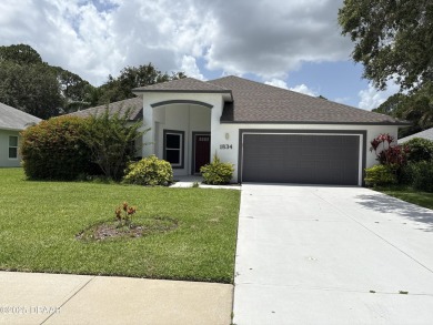 This Johnson-built block home is move in ready, located in the on Turnbull Bay Golf Club in Florida - for sale on GolfHomes.com, golf home, golf lot